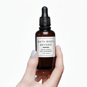 Bath Body Beyond Blue Tansy and Rosemary Hair Serum in an amber dropper bottle